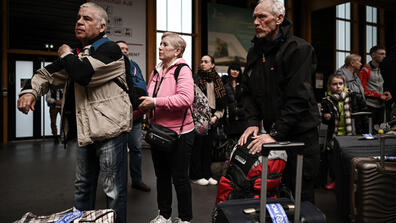 Ukrainian refugees at a terminal